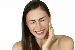 <a href="https://www.freepik.com/free-photo/woman-holds-fingers-her-cheek-showing-toothache_1621690.htm#query=toothache&position=6&from_view=search&track=sph">Image by freepic.diller</a> on Freepik