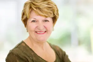senior woman with nice smile dentures concept