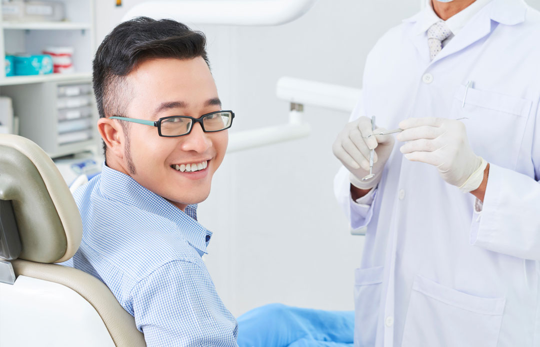 Person smiling after dental exam